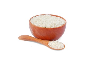 Rice with wooden bowl and wooden spoon isolated on white background