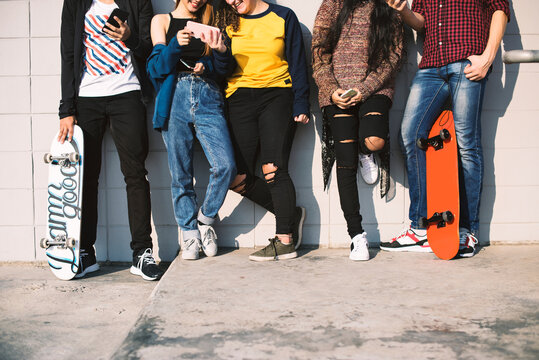 Group of teenage friends outdoors lifestyle and social media concept