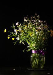 A bouquet of wild flowers in low key