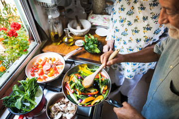 Senior couple cooking in the kitchen