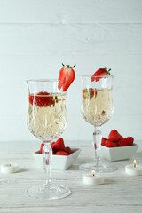 Concept of delicious drink with Rossini cocktail on white wooden table