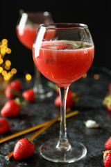 Concept of delicious drink with Rossini cocktail on background with blurred lights