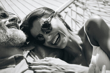 Couple resting together in a hammock