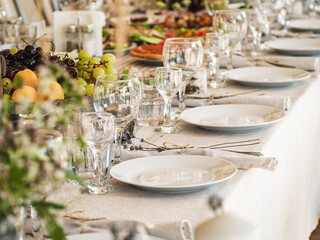 Served festive table. Preparation for the holiday. Daylight, close-up