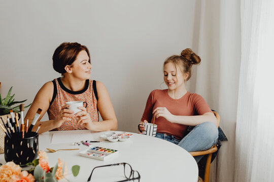 Friends taking a break from painting