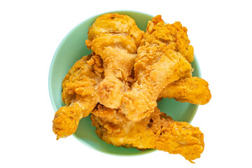 Fried chicken legs in a plate isolated on white background. Classic fast food.