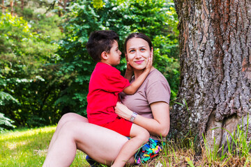 Fototapeta premium mother and son having fun in nature
