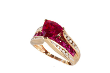 Yellow gold ring with rubies and diamonds, isolated on a white background