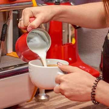 cafe worker making coffee on professional coffee maker close up, can be background for delicious product