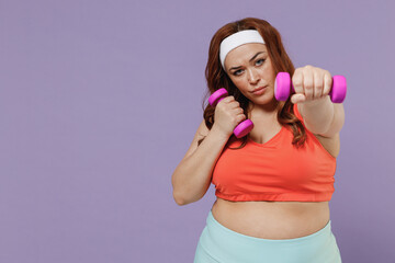 Young chubby overweight plus size big fat fit woman in red top towel warm up training stratch hand with dumbbells do exercises isolated on purple background home gym Workout sport motivation concept. - Powered by Adobe