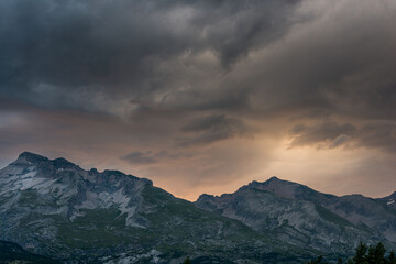 dramatic sunset in the French alps ,devoluy,with treatening storm clouds , concept of the danger of extreme weather in the mountains