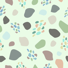 Doodle colorful shapes of different size on a cold green-blue  background. Seamless minimal abstract pattern. Suitable for packaging, cover, prints.
