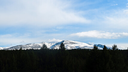 snow caps of mountain peaks in the distance