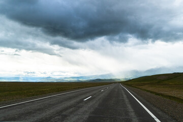 road, mountains, clouds and sky