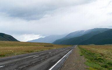 road, mountains, clouds and sky