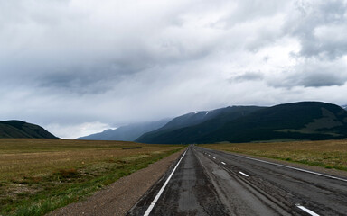 road, mountains, clouds and sky