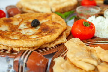 Traditional fried pies from Romania with potatoes, cheese and cabbage. Romanian food.