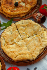Traditional fried pies from Romania with potatoes, cheese and cabbage. Romanian food.