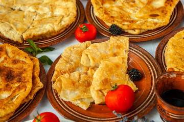 Traditional fried pies from Romania with potatoes, cheese and cabbage. Romanian food.