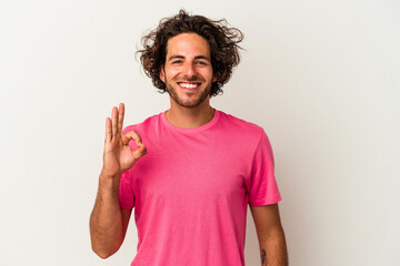 Young caucasian man isolated on white background cheerful and confident showing ok gesture.