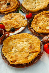 Traditional fried pies from Romania with potatoes, cheese and cabbage. Romanian food.