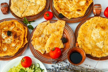 Traditional fried pies from Romania with potatoes, cheese and cabbage. Romanian food.