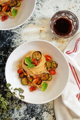Italian spaghetti with tomato, fried eggplant and bacon