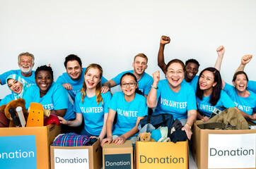 Group of diverse people with donated stuff