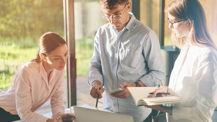 Cropped portrait of concentrated developers at workplace