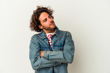 Young caucasian man isolated on white background dreaming of achieving goals and purposes