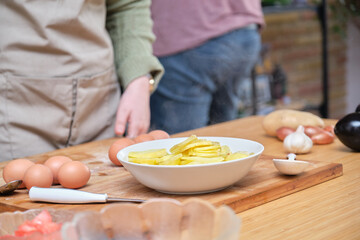 Obraz na płótnie Canvas Hot sliced potatoes on a dish. Cooking Spanish omelette.