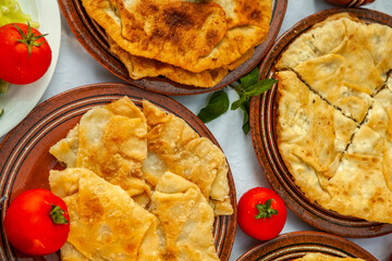 Traditional fried pies from Romania with potatoes, cheese and cabbage. Romanian food.