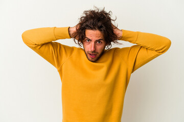 Young caucasian man isolated on white background screaming, very excited, passionate, satisfied with something.