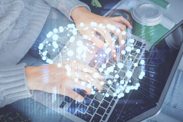 Double exposure of woman hands working on computer and brain hologram drawing. Ai concept.