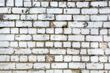 horizontal background of aged white brick cracked wall