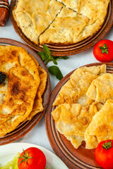 Traditional fried pies from Romania with potatoes, cheese and cabbage. Romanian food.