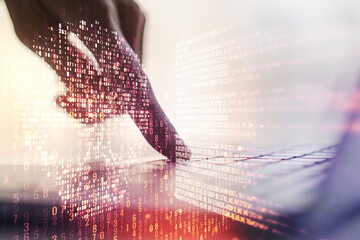 Double exposure of creative code skull hologram and hands typing on laptop on background. Malware...