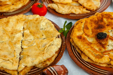 Traditional fried pies from Romania with potatoes, cheese and cabbage. Romanian food.