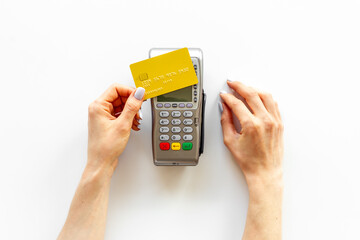 Hand paying by card with pos payment terminal. Payment transactions concept