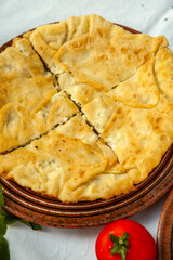 Traditional fried pies from Romania with potatoes, cheese and cabbage. Romanian food.