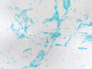 
Grunge texture of a concrete wall with drops and splashes of smudged paint. Background for fashion covers and posters