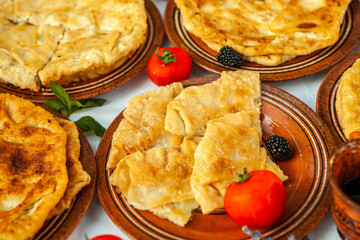 Traditional fried pies from Romania with potatoes, cheese and cabbage. Romanian food.