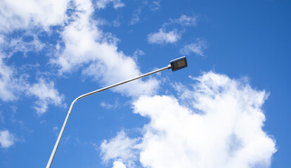 Street lamp, lamp pole on blue sky background