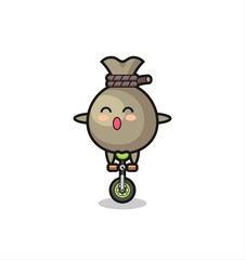 The cute money sack character is riding a circus bike