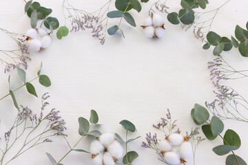 Top view image of flowers composition on white background .Flat lay
