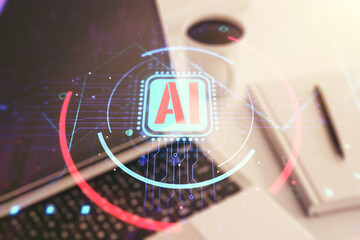 Double exposure of creative artificial Intelligence abbreviation with computer on background....