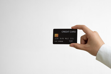 Close up female hand holds levitating template mockup Bank credit card with online service isolated on white background