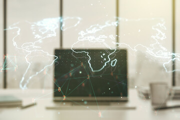 Abstract creative world map on modern laptop background, international trading concept. Multiexposure