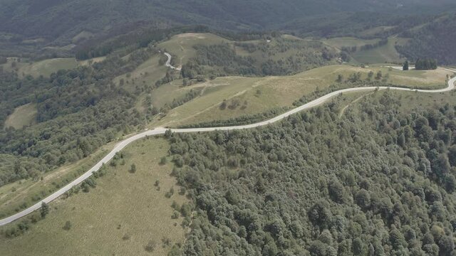 Aerial footage drone view of Mottarone mountain forest with fog in Piemonte Italy // no video editing
