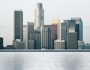 Empty concrete rooftop on the background of a beautiful Los Angeles city skyline at daytime, mockup